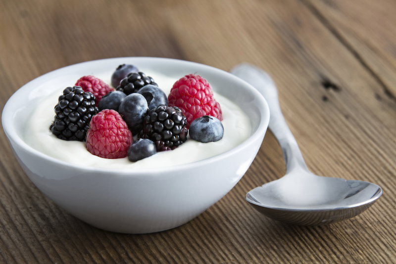 Bowl of fresh mixed berries and yogurt