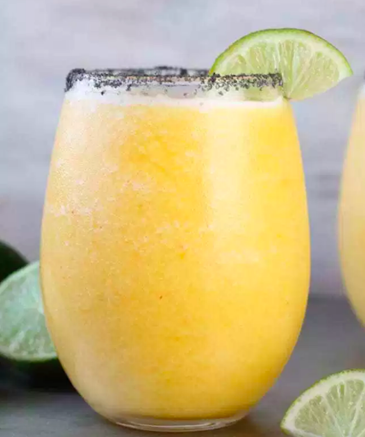 STYLECASTER | 17 Easy Blender Cocktails That Make Any Day Feel Like Vacation | Frozen Peach Margaritas