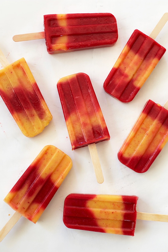 STYLECASTER | 17 DIY Popsicles To Make With All That Summer Fruit | Raspberry Peach Popsicles