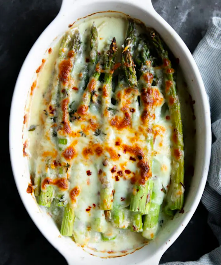 STYLECASTER | 17 Vegetable Recipes That Are Mostly Just Cheese | Easy Baked Asparagus Gratin