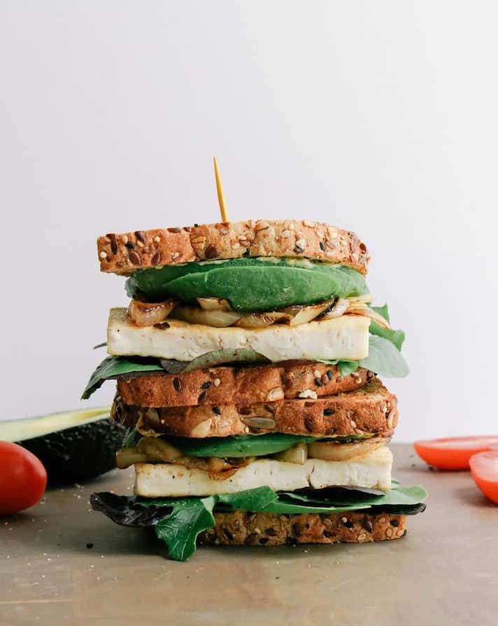 STYLECASTER | 19 High-Protein Veggie Sandwiches That Are Sure To Satisfy | Avocado-Tofu Sandwich With Caramelized Onions