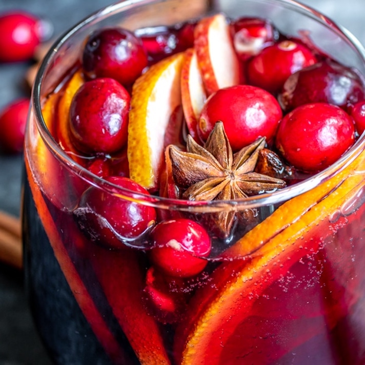 STYLECASTER | 15 Big-Batch Holiday Cocktails You Can Make With Boxed Wine | Winter Cranberry Sangria