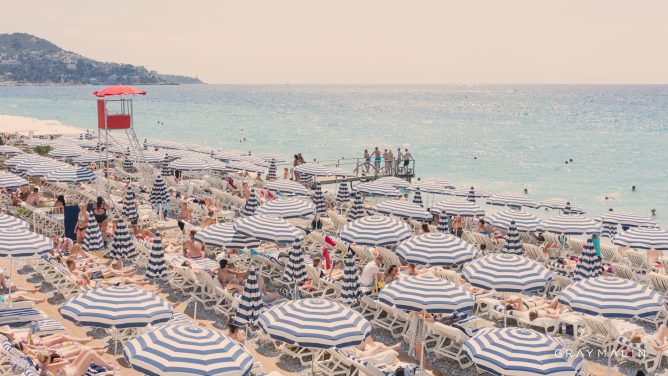 striped umbrellas in Nice on beach