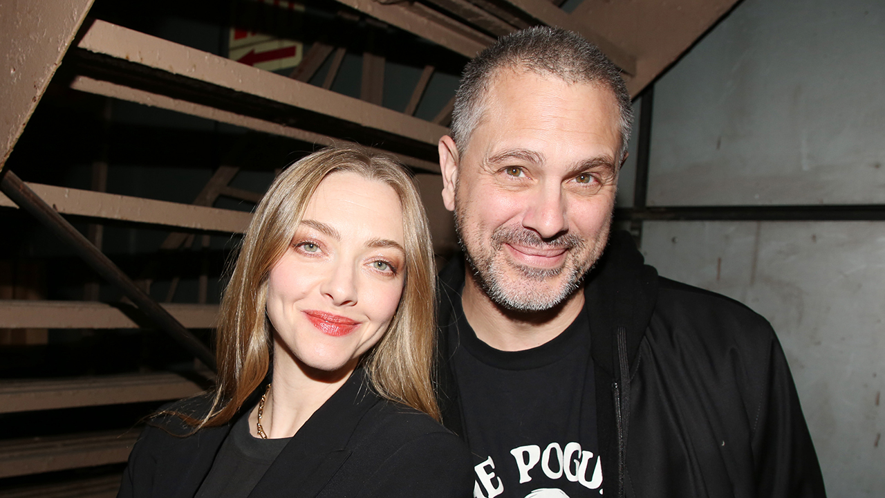 NEW YORK, NEW YORK - NOVEMBER 19: Amanda Seyfried and Thomas Sadoski pose at the opening night of the new Avett Brothers musical "Swept Away" on Broadway at The Longacre Theatre on November 19, 2024 in New York City.