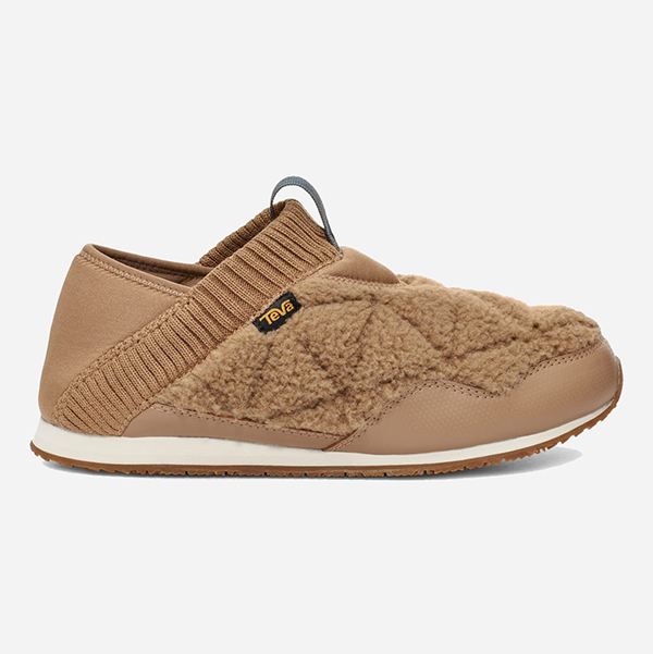 A slip-on flat lined with quilted brown bouclé fabric