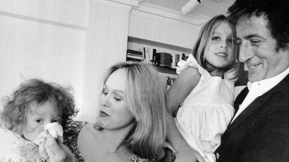 Tony Bennett at home with his family. His wife helps Antonia with sniffles and dad takes care of Joanna.