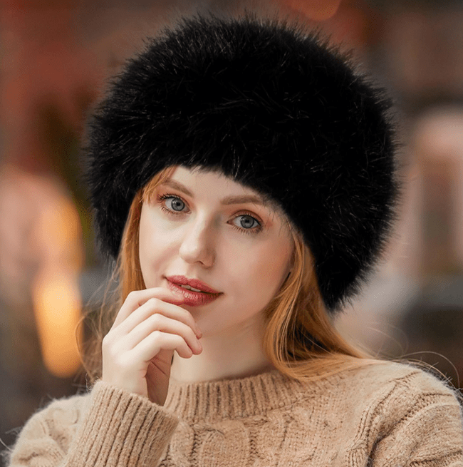 A model wearing a black faux fur hat from Amazon