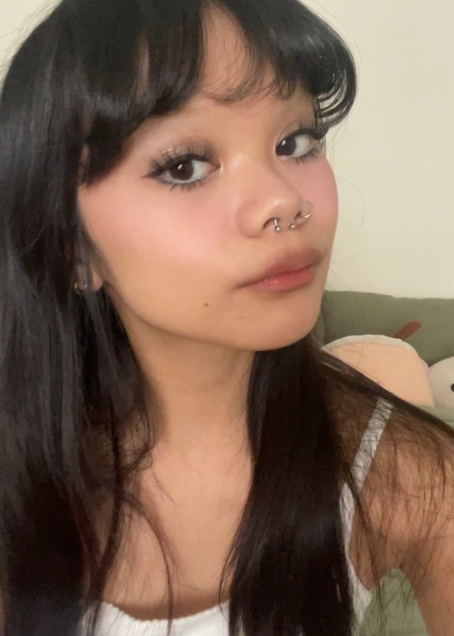 The writer wearing Kaja's Mocha Sparkle eyeshadow stick topped with the Peach Sprinkle glitter stamp