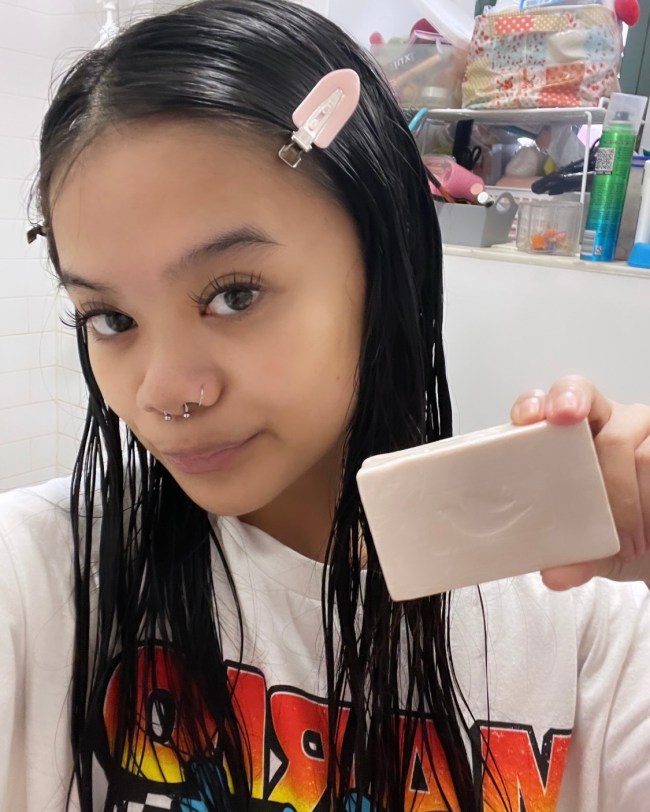The writer holding a Dove Plant Milk Cleansing Bar