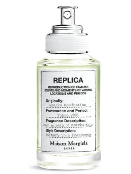 Maison Margiela REPLICA Matcha Meditation perfume. It has a big REPLICA label on the front and is in a clear bottle.