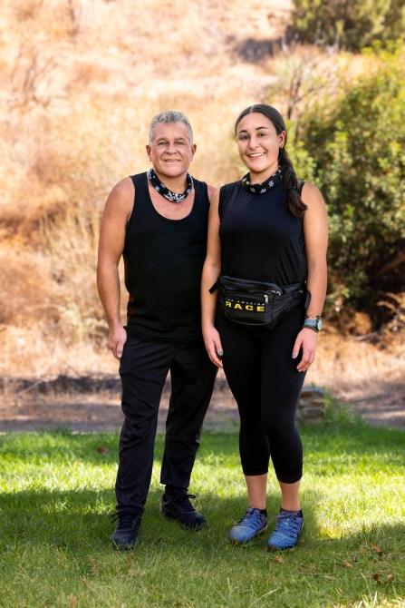 Chris Foster and Mary Cardona Foster, a white man and white woman in matching bandanas and black athletic wear