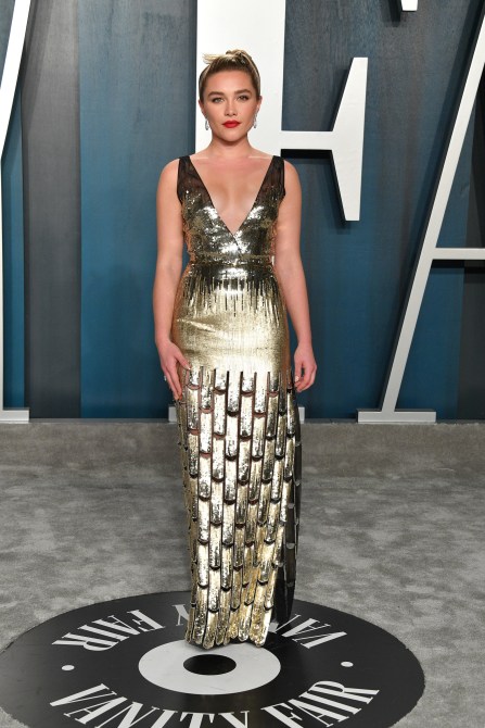 Florence Pugh in a gold sequin gown and red lipstick at the Vanity Fair Oscars afterparty