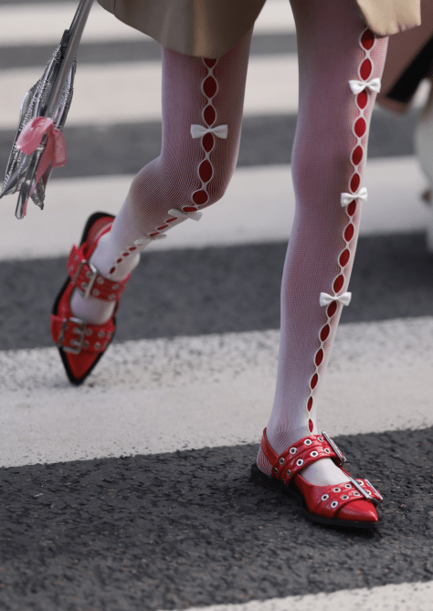 A Paris Fashion Week guest wearing red slingback shoes.