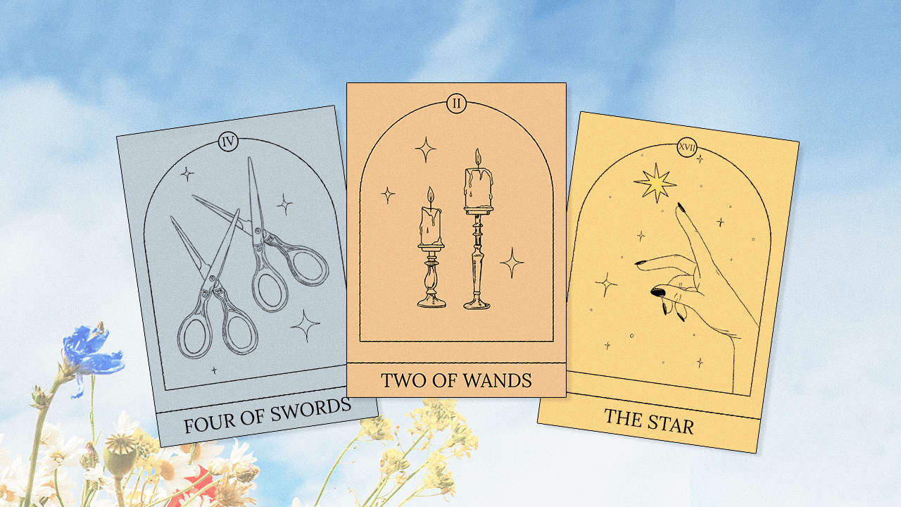 A selection of three Tarot cards to represent your monthly reading, surrounded by delicate springtime flowers