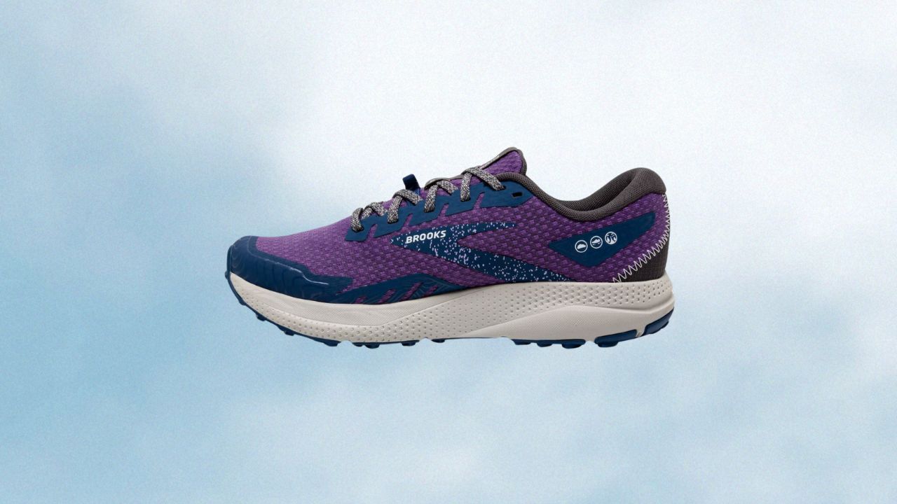 Purple running sneakers from Brooks on a cloud background