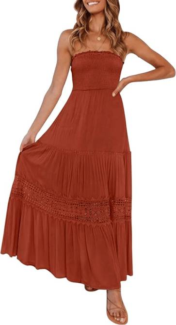 A model wearing the ZESICA Bohemian Strapless Maxi Dress in a burnt orange-range colorway