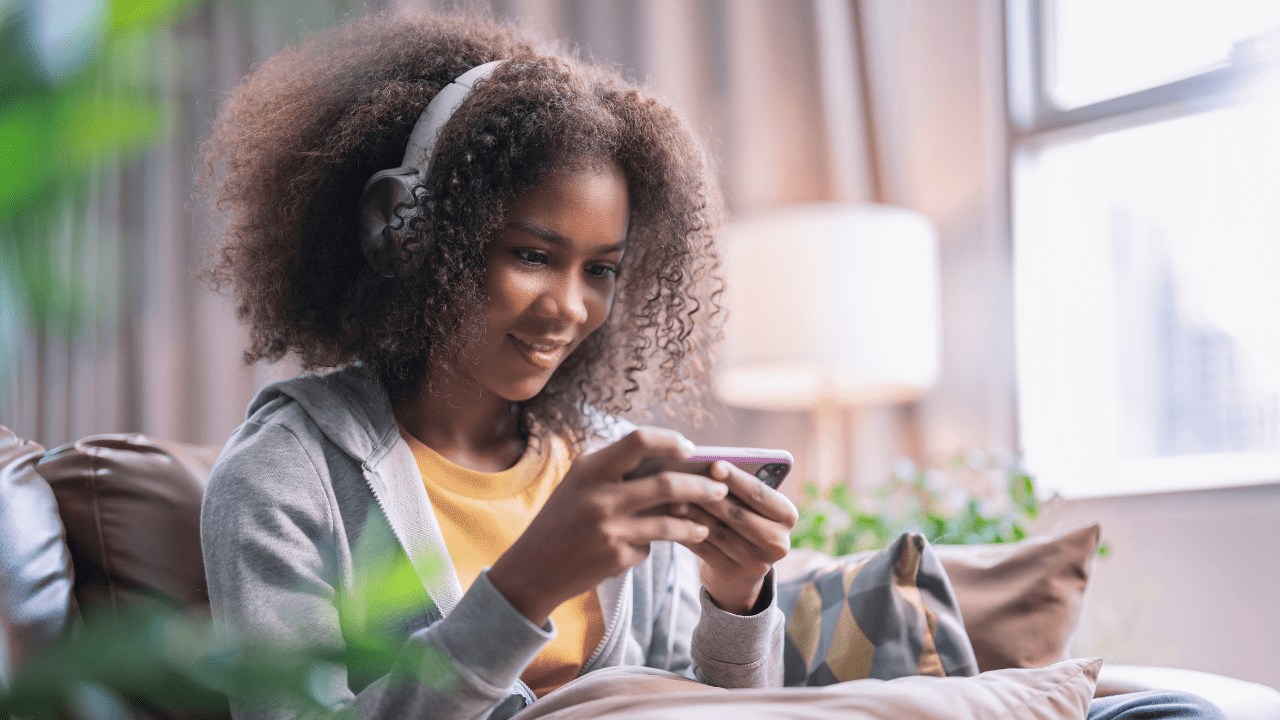 Girl playing a game on her phone