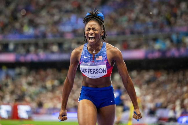 Melissa Jefferson of Team United States celebrates winning the bronze medal after competing the Women's 100m Final on day eight of the Olympic Games Paris 2024 at Stade de France on August 3, 2024 in Paris, France.