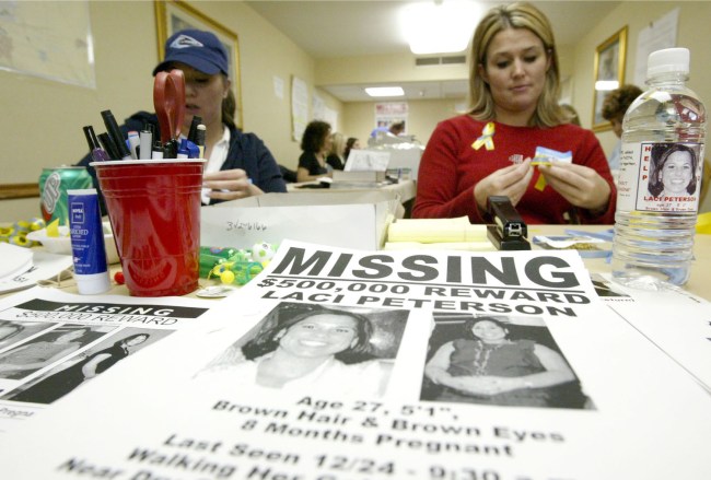 Volunteer Stacey Boyers folds yellow ribbons near a bottle displaying a label with a picture of the missing Laci Peterson January 4, 2003 in Modesto, California. Peterson, who is eight-months pregnant, has been missing since December 24, 2002 when she allegedly took her dog for a walk in the park while her husband was on a fishing trip. There is a half-million dollar reward for her safe return.