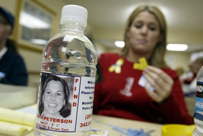 MODESTO, CA - JANUARY 4:  Volunteer Stacey Boyers folds yellow ribbons near a bottle displaying a label with a picture of the missing Laci Peterson January 4, 2003 in Modesto, California. Peterson, who is eight-months pregnant, has been missing since December 24, 2002 when she allegedly took her dog for a walk in the park while her husband was on a fishing trip. There is a half-million dollar reward for her safe return.