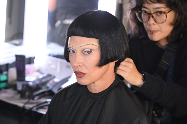 A model prepares backstage for TRESemme X Christian Cowan on September 08, 2024