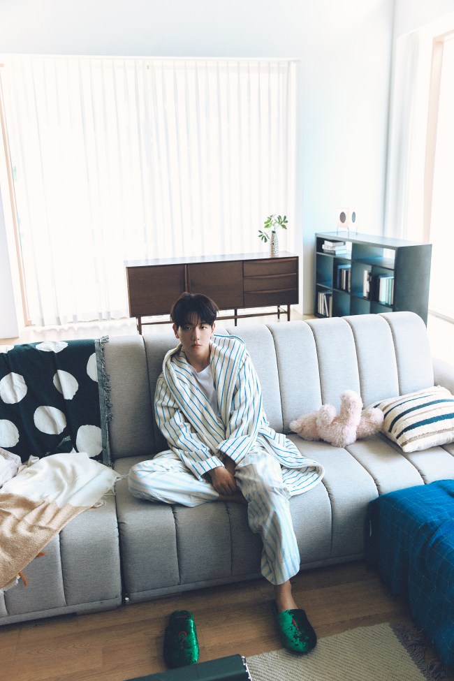 Baekhyun sitting on a couch