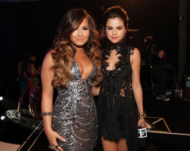 LOS ANGELES, CA - AUGUST 28:  Singer/actresses Demi Lovato (L) and Selena Gomez arrive at the 2011 MTV Video Music Awards at Nokia Theatre L.A. LIVE on August 28, 2011 in Los Angeles, California.
