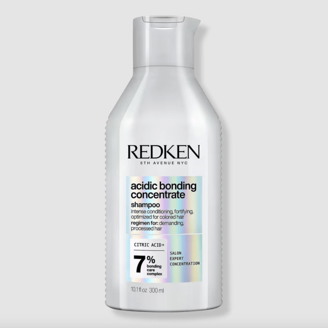 Redken Acidic Bonding Concentrate Shampoo in a silver bottle.