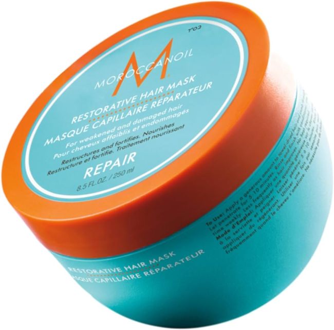 Moroccanoil Restorative Hair Mask in a turquoise jar.