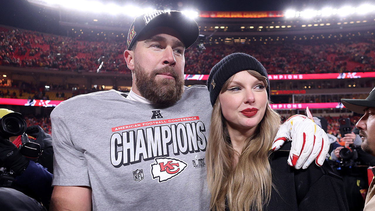 KANSAS CITY, MISSOURI - JANUARY 26: Taylor Swift celebrates with Travis Kelce #87 of the Kansas City Chiefs after defeating the Buffalo Bills 32-29 in the AFC Championship Game at GEHA Field at Arrowhead Stadium on January 26, 2025 in Kansas City, Missouri.