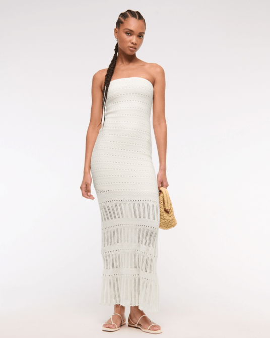 A model wearing the Strapless Crochet-Style Midi Dress in Cream