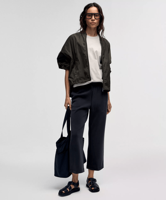 A model wearing the Lululemon Softstreme High-Rise Straight-Leg Cropped Pant in black