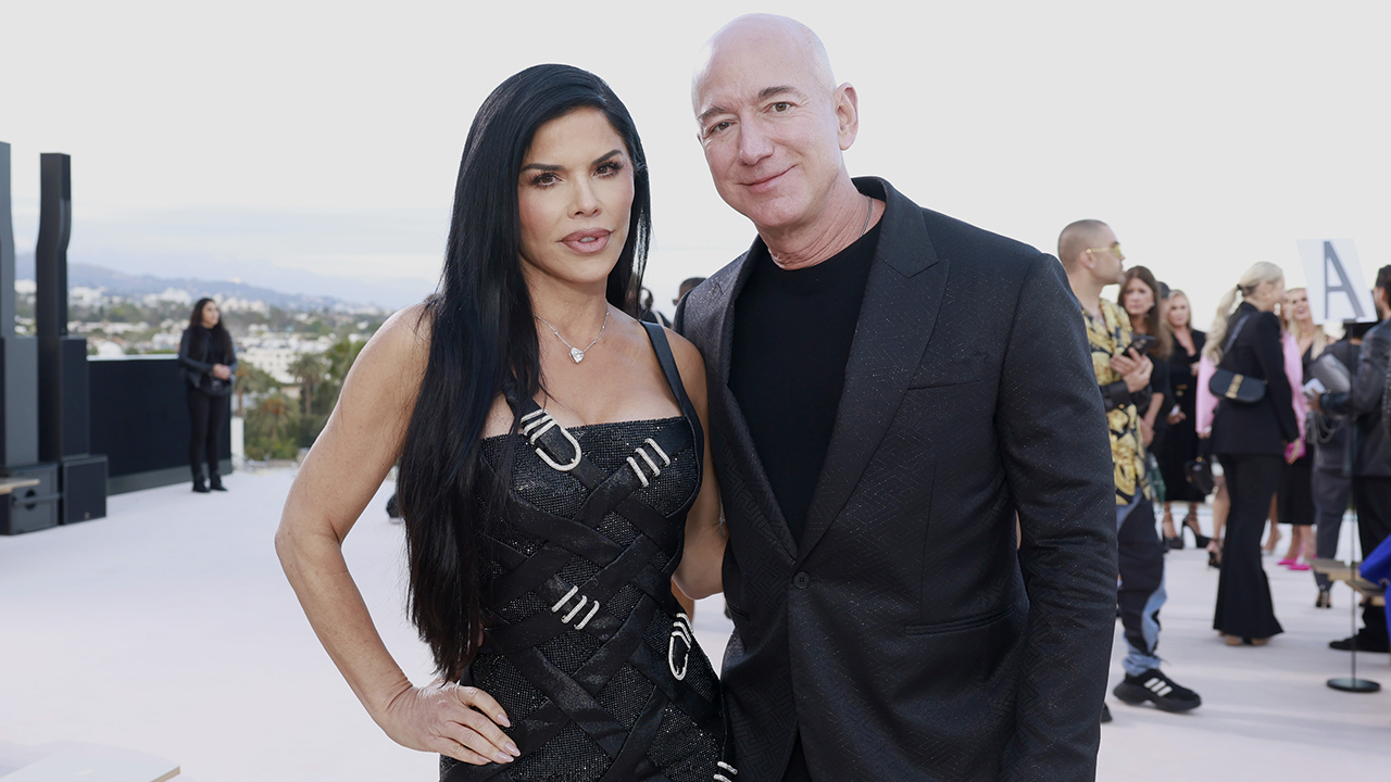WEST HOLLYWOOD, CALIFORNIA - MARCH 09: (L-R) Lauren Sánchez and Jeff Bezos attend the Versace FW23 Show at Pacific Design Center on March 09, 2023 in West Hollywood, California.