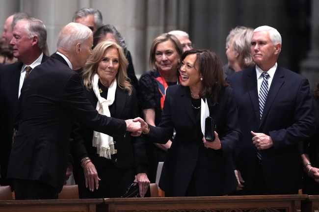 Former U.S. Vice President Kamala Harris greets former President Joe Biden, as former first lady Jill Biden, and former Vice President Mike Pence watch during the funeral service of former Vice President Dick Cheney at the National Cathedral on November 20, 2025 in Washington, DC. Cheney, who served as the 46th Vice President under President George W. Bush and as the 17th Secretary of Defense, passed away at the age of 84 due to complications from pneumonia and vascular disease.